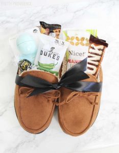 On the list of best gifts for father's day? This cute slippers gift pack! Stuff some comfy slippers with some of dad's favorite things.