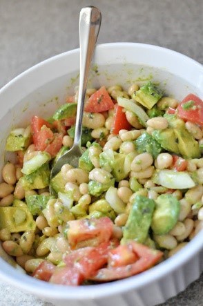 Easy salad recipes don't always have to be boring greens and tasteless dressing. This white bean salad with avocado is so far from boring! It's quick to pull together and you won't find an easier recipe for a potluck or backyard party.