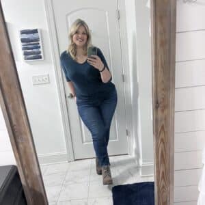 Rosemarie Groner, wearing a blue teal boatneck sweater and skinny jeans. 