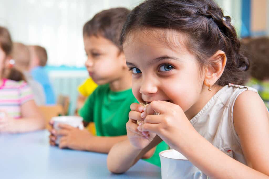 Cute little children eating