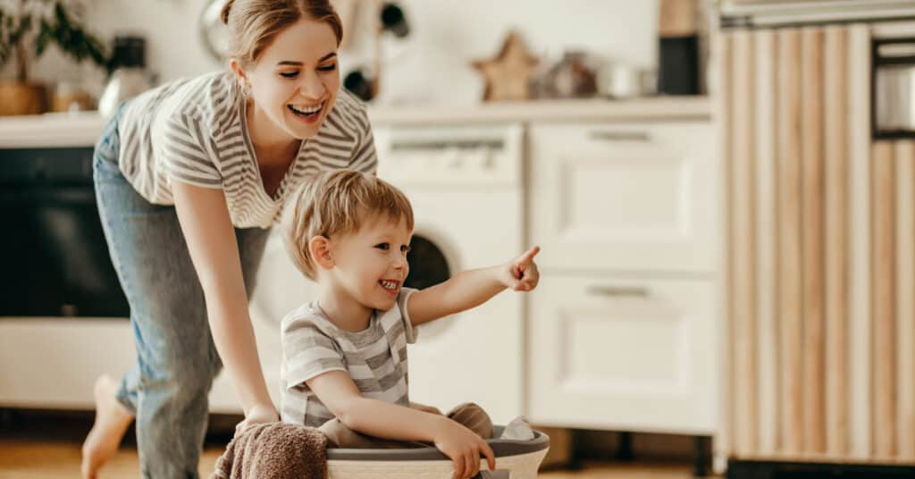 Mom and son doing laundry