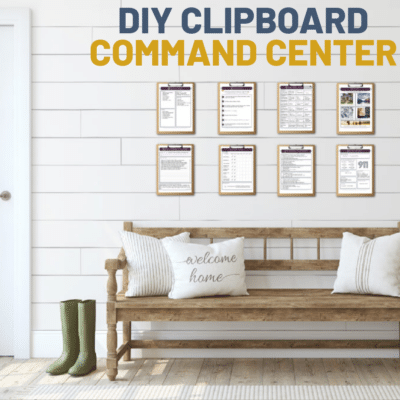 WOODEN OAK BENCH WITH GREEN HUNTER BOOTS AND WHITE PILLOWS, A DIY FAMILY CLIPBOARD COMMAND CENTER ABOVE THE BENCH SHOWING THE FAMILY'S GOALS, CALENDAR, DINNERS, TO DO LIST, AND MORE