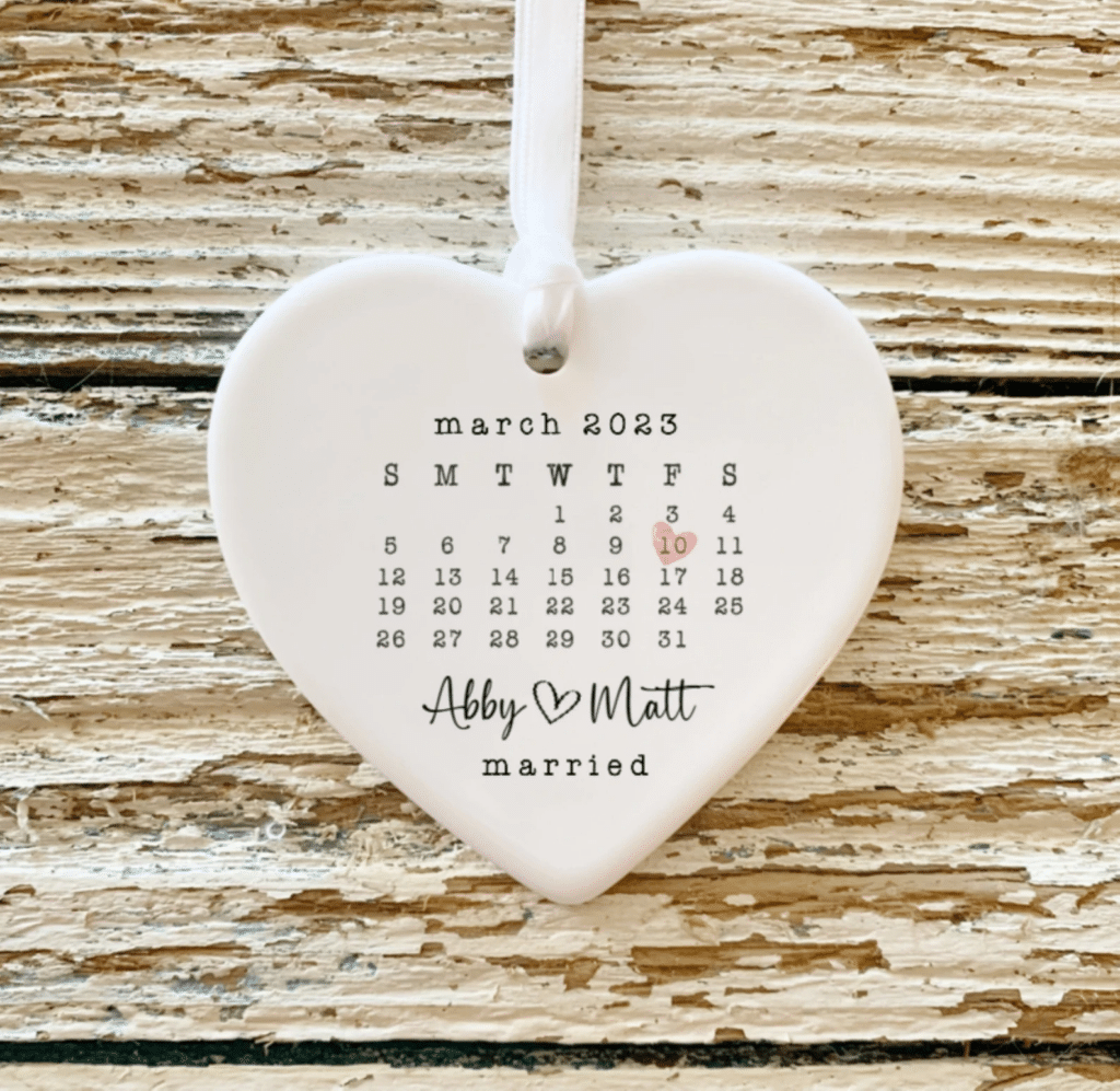 Married Christmas ornament- white ceramic heart with month calendar and a pink heart to mark the wedding date
