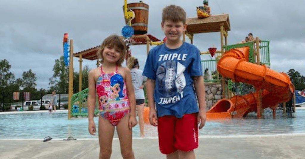 Two kids (brother and sister) ready to take on the waterpark.