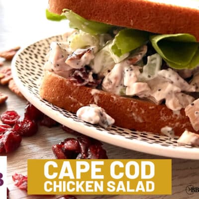 Cape cod chicken salad on sweet hawaiian bread with green lettuce on a Table & Thyme Black and white dotted plate from Walmart. Text overlay says "Cape Cod Chicken Salad"